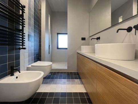 Bagno in stile contemporaneo di 6 di Officine Architetti Associati Bagno in stile contemporaneo di 6 di Officine Architetti Associati