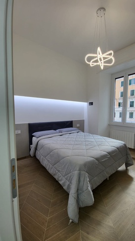 Camera da Letto in stile contemporaneo di 14 di Arch.j Floriana Ferraioli Camera da Letto in stile contemporaneo di 14 di Arch.j Floriana Ferraioli