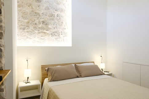 Camera da Letto in stile rustico di 14 di ValentinaZoccoArchitetto