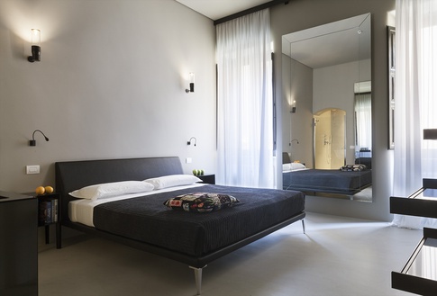 Camera da Letto in stile eclettico di 60 di COLLETTIVO_INVƎRSO