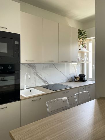 Open Space in stile contemporaneo di 25 di Silvia Aquilani . Design studio