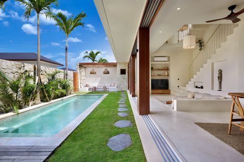 Piscina in stile tropicale di 100 di Riccardo Rubelli Architetto