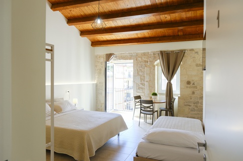 Camera da Letto in stile rustico di 22 di ValentinaZoccoArchitetto