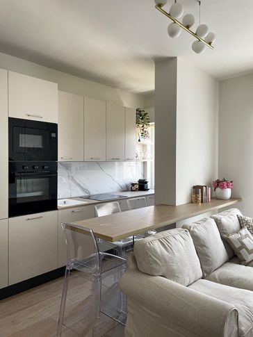 Open Space in stile contemporaneo di 25 di Silvia Aquilani . Design studio