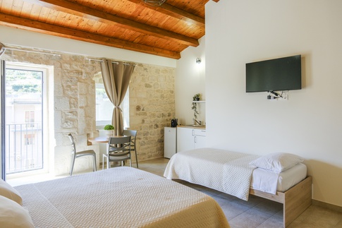 Camera da Letto in stile rustico di 22 di ValentinaZoccoArchitetto