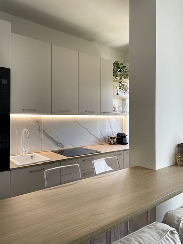 Open Space in stile contemporaneo di 25 di Silvia Aquilani . Design studio